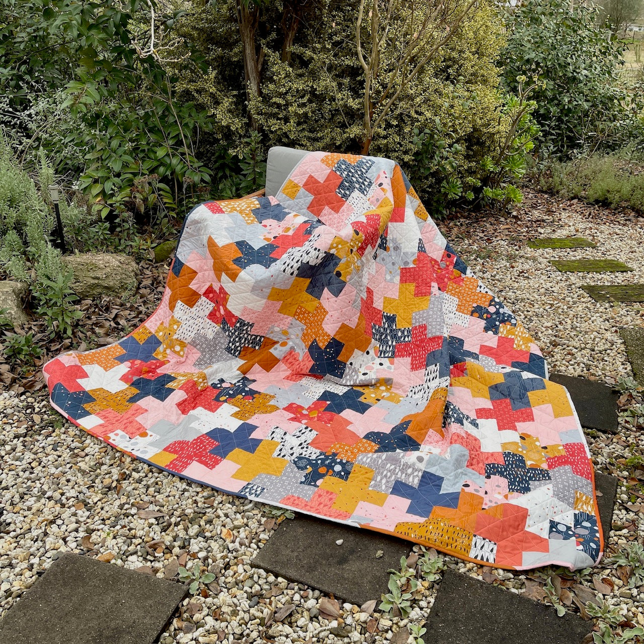 Queen Sized Plus Quilt Draped over a Chair