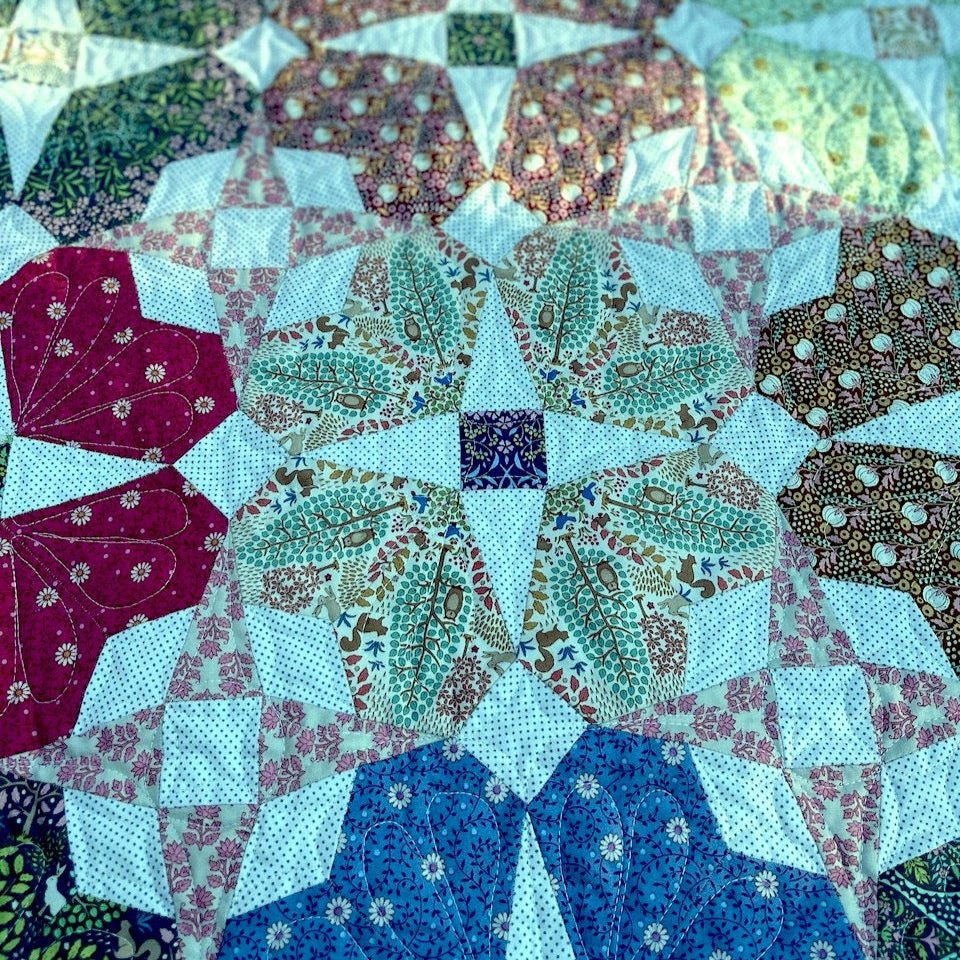 A close up of the Secret Garden quilt blocks