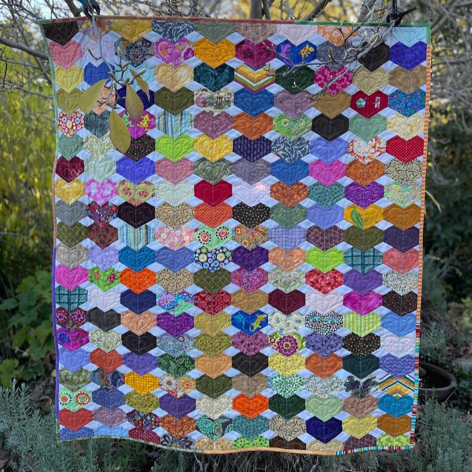 Chain of Hearts Quilt hanging in a tree