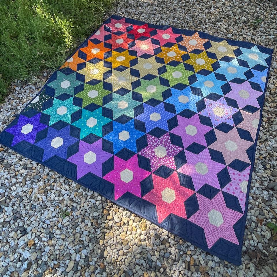 The Night Blooms quilt shown from an angle