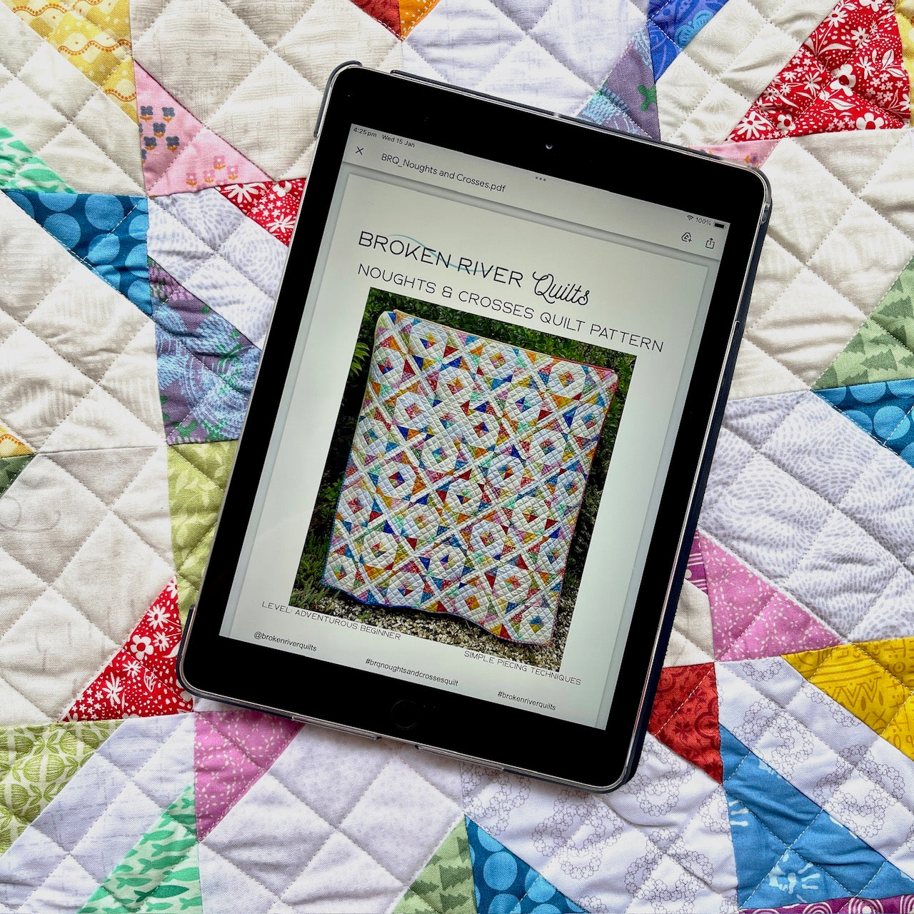 Noughts and Crosses Pattern on an iPad with the quilt in the background