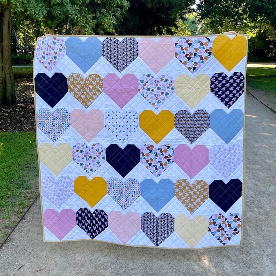 The Sweetheart Quilt being shown in full so that you can see all of the coloured hearts.