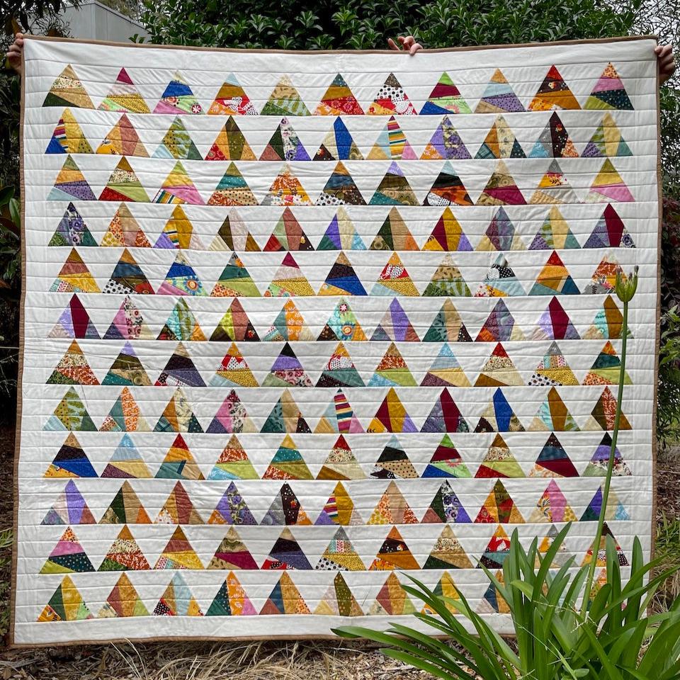 The Triangle Quilt being shown in full so that you can see all of the pieced triangles